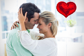 Red heart balloon against romantic couple embracing at home 3d