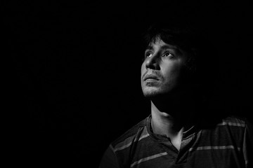 portrait of a young man in a low key