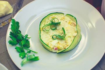 process of preparation of salad by the child at school of young cooks