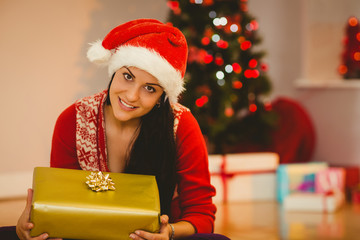 Festive brunette smiling at camera