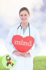 The word mind and doctor holding red heart card  against green field