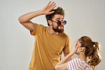 woman with eyes closed and a man with glasses