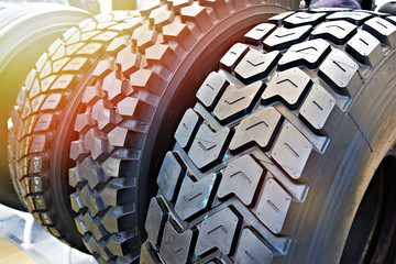 Tread pattern on wheel tire truck in store - obrazy, fototapety, plakaty