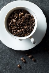 Cup with whole coffee beans