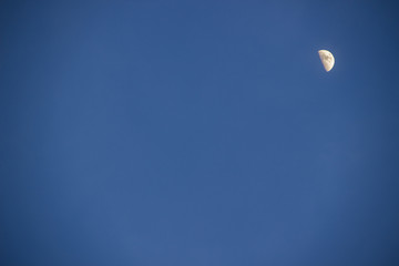 blue sky glow moon in the upper right corner