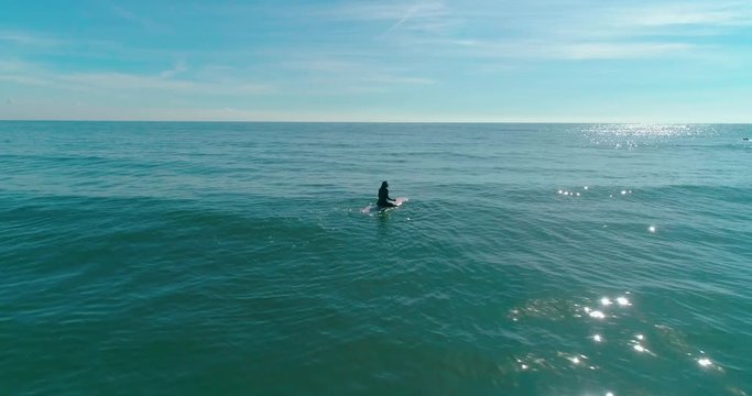 Aerial footage of people who are surfing. Surfers, students. Malibu Beach. California. May 2018. 4K slow motion video. Drone.