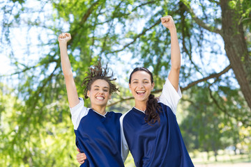 Pretty football players cheering at camera