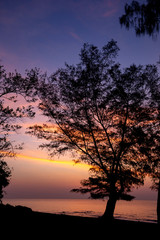 Nice sky, clouds and sun above the beautiful sea and sand beach with little waves at the morning moment.