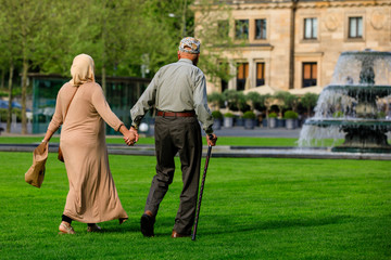 Fototapeta premium Senior couple walking hand in hand