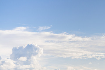 Naklejka na ściany i meble Large white Cumulus clouds on blue sky