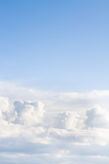 Large white Cumulus clouds on blue sky