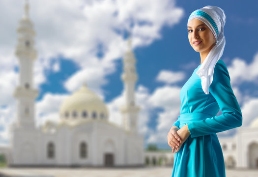 Muslim woman on white mosque background