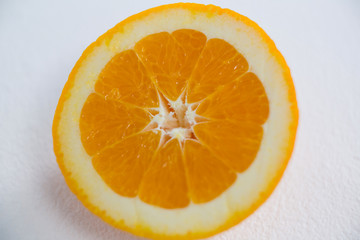 Ripe tasty orange cut into halves