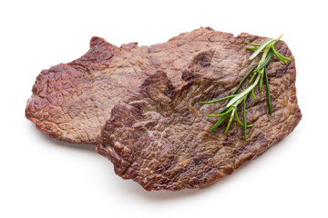 Grilled beef steaks with spices isolated on white background.
