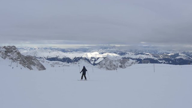 Person skiing slowly on a ski slope