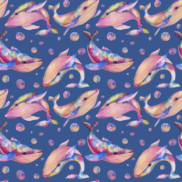 Seamless pattern with watercolor whales, hand painted on a blue background