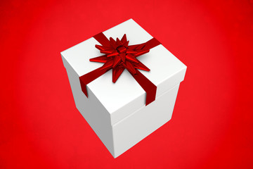 White and red gift box against red background