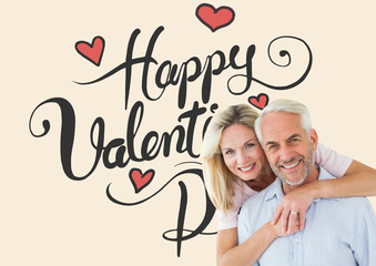 Smiling couple embracing and looking at camera against happy valentines day