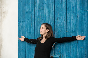 Young woman meditating in the spring sunshine