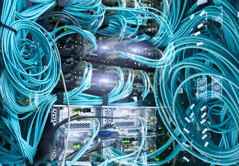 Computers broadband internet. Fiber Optical connector interface. Fibre Channel swich. Severs computer in a rack at the large data center. 