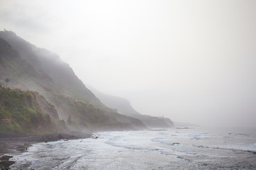 Misty island,Mysterious seascape in light fog.
