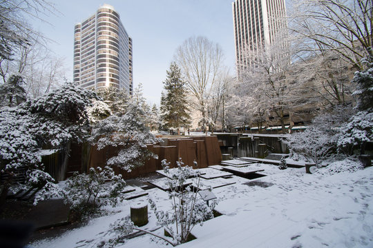 Keller Fountan park in Portland, Oregon covered in snow, with footprints throughout.