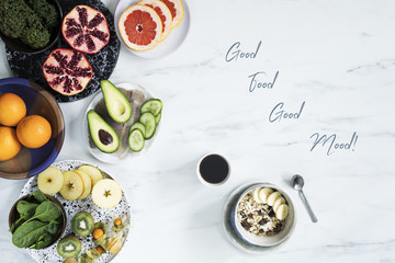 Enjoy healthy breakfast. Top view of different vegetarian food on the white marble table...