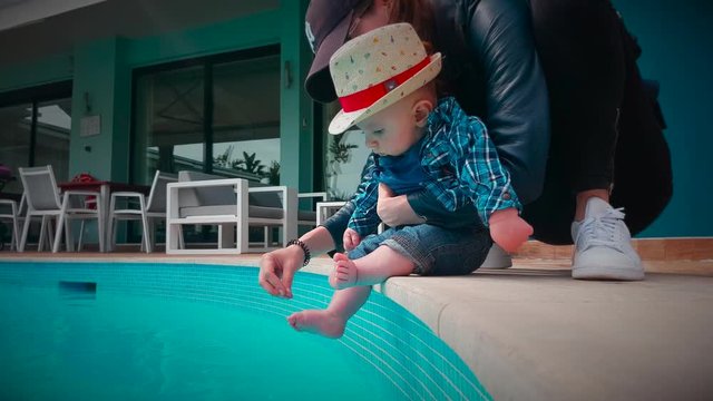 Cute Baby Boy Discovering The Water at The Pool. Close Up View - DCi 4K Resolution