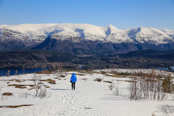 Hike in snow on Langheistabben mountail in Northern Norway