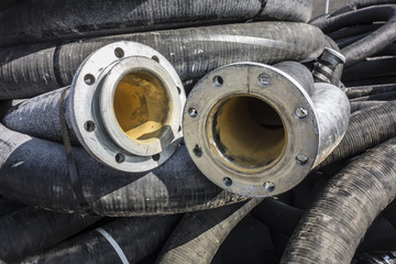 Pressure suction reinforced, universal hose for suction and delivery of abrasive materials