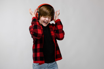 Teenage boy in fashionable clother and headphones