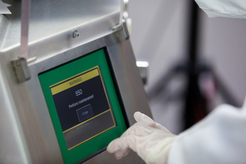 Obraz premium Butcher operating machine at meat factory