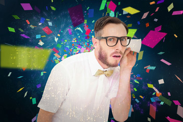 Geeky businessman eavesdropping with cup against colourful fireworks exploding on black background
