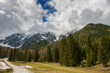 Snow on the peaks with dramatic sky in Austrian Alps