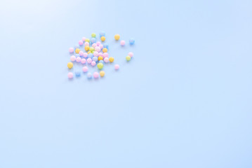 Obraz na płótnie Canvas multicolored foam balls on blue background