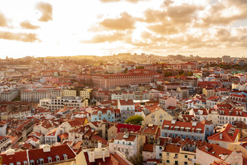 Fototapeta na wymiar Old Lisbon Portugal panorama. cityscape with roofs. Tagus river. miraduro viewpoint