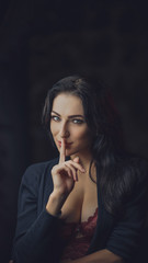 Fototapeta premium portrait of playful, sexy brunette