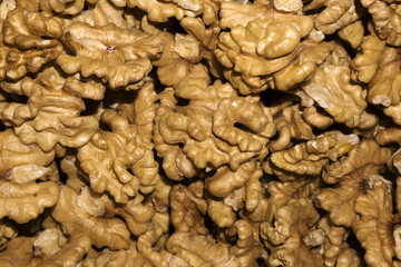 background - golden kernels of peeled walnuts