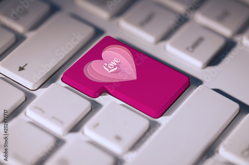Love Heart Against Pink Enter Key On Keyboard Stock Photo