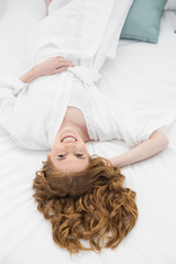 Obraz na płótnie Canvas Overhead portrait of pretty woman resting in bed