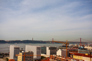 Fototapeta premium Old Lisbon Portugal panorama. cityscape with roofs. Tagus river. miraduro viewpoint. View from sao jorge castle