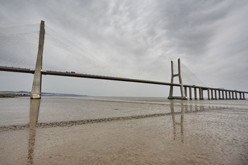 The Vasco da Gama Bridge in Lisbon, Portugal in a summer day. beautiful colors