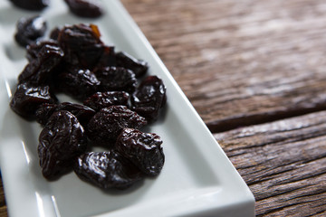 Date palms in a tray on wooden table