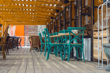 Green chairs in an empty summer cafe