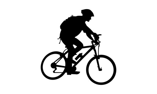 the silhouette of a man riding a mountain bike with a backpack