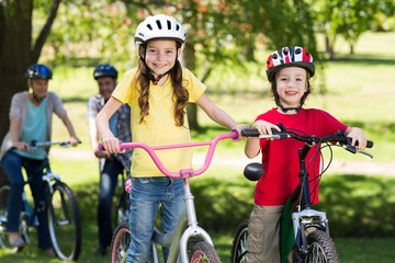 Happy family on their bike at the park 