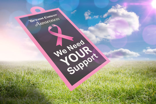 Breast cancer awareness message on poster against sunny landscape