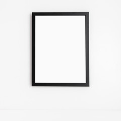 Photo frame on a white wall. Minimal mock up.