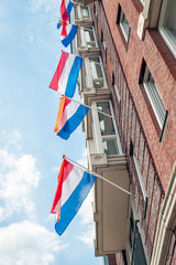 Dutch flags fluttering above each other