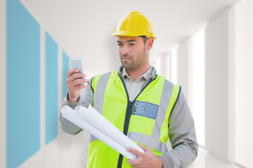 Architect on the phone against modern blue and white room